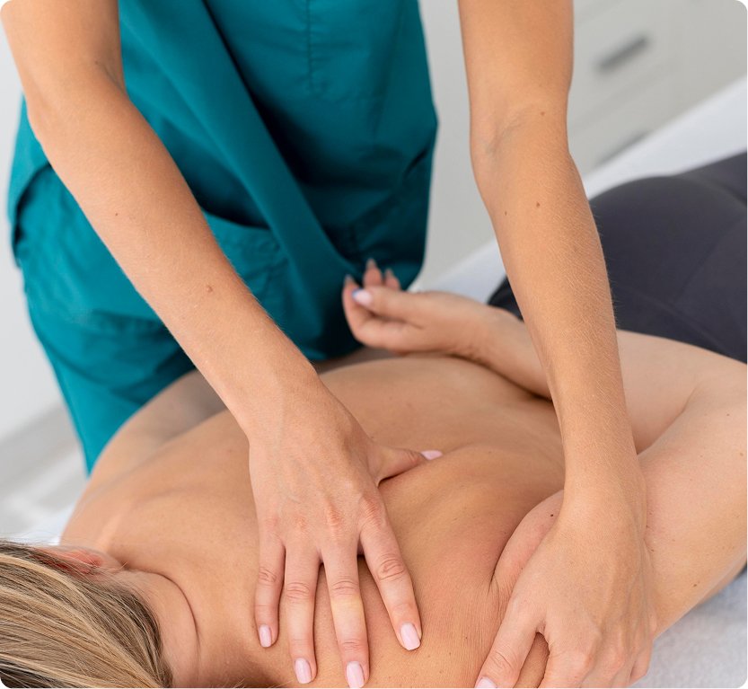Ostheopath manipulating a patient's upper back and shoulder