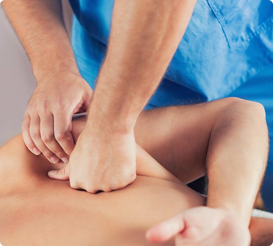 Osteopath in Singapore applying manual pressure to patient's back